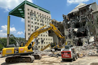 Workers knock down the former Coca-Cola Co. museum in downtown Atlanta.