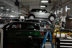 Cooper models in the service bay of a Mini dealership, Highlands Ranch, Colo., Nov. 3, 2022.