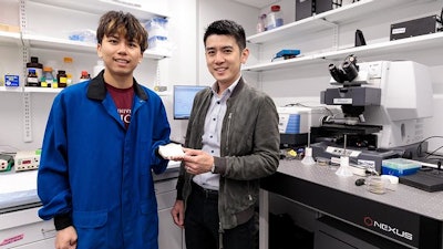 UChicago Pritzker School of Molecular Engineering PhD candidate Chenxi Sui (left) and Asst. Prof. Po-Chun Hsu show off a sample of a new cooling textile that reflects both direct sunlight and the thermal radiation from pavement and buildings in urban heat islands. Their results, published in Science, show the material keeps 2.3 degrees Celsius (4.1 degrees Fahrenheit) cooler than outdoor endurance sports fabric and 8.9 degrees Celsius (16 degrees Fahrenheit) cooler than commercialized silk.