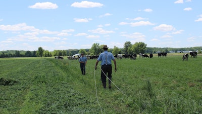 Organic Valley farmer-owners in Iowa set up a new fence for their cows.