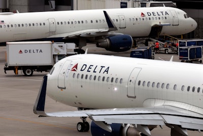 A Delta Air Lines plane leaves the gate July 12, 2021, at Logan International Airport in Boston.