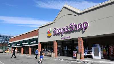 People walk outside a Stop & Shop in Newport, R.I.