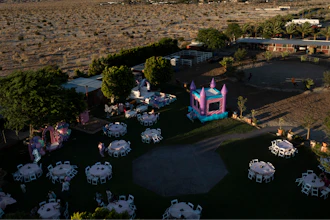 Carlos Ulloa's Rancho El Refugio date palm ranch decorated for a baptism ceremony in Thousand Palms, Calif.