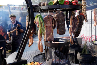A chef cooks food to sell to visitors at the opening ceremony for the Rural Society's annual exposition in Buenos Aires, Argentina.