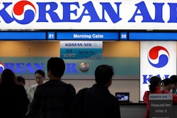 Passengers approach a Korean Air counter at Gimpo airport, Seoul, Oct. 25, 2012.