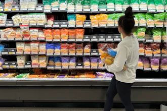 A shopper peruses cheese offerings at a Target store in Sheridan, Colo., Oct. 4, 2023.