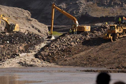 This image provided by Matthew John Mais shows crews working at the Iron Gate cofferdam site along the Klamath River in Siskiyou County, Calif.