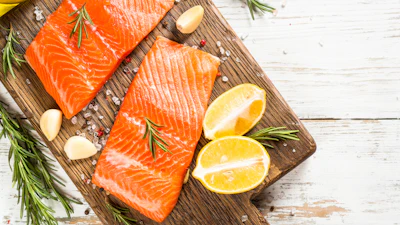 Salmon filet on a cutting board.