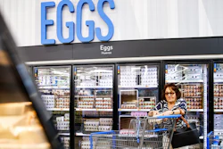A woman buys eggs at a Walmart Superstore in Secaucus, New Jersey, July 11, 2024.