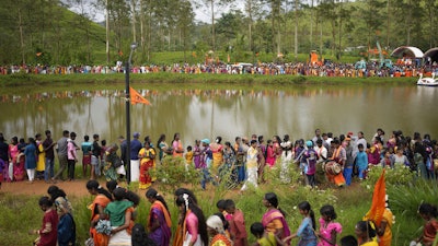 Tea plantation workers and their children take part in a Hindu religious procession in Hatton, Sri Lanka, Sept. 8, 2024.