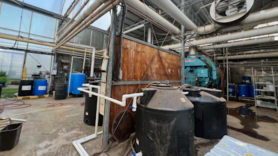 A commercial-scale, in-series pair of 300-gallon anaerobic to aerobic woodchip bioreactors at Michigan State University.