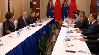 In this image made from Australia Pool video, Australian Prime Minister Anthony Albanese, second left, talks with Chinese Premier Li Qiang, second right, on the sidelines of ASEAN summit talks, Vientiane, Laos, Oct. 10, 2024.