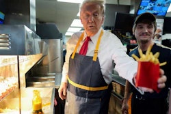 Former President Donald Trump hands off an order of fries at a McDonald's in Feasterville-Trevose, Pa., Oct. 20, 2024.