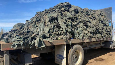 Plastic removal from a field.