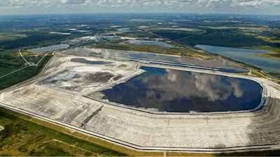 A sinkhole that opened up underneath a gypsum stack at a Mosaic phosphate fertilizer plant is seen in Mulberry, Fla., on Sept. 16, 2016.
