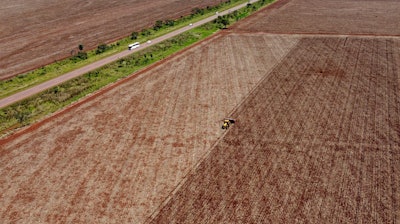A machine plants soybeans on a farm in a rural area of Sidrolandia, Brazil, Oct. 22, 2022.