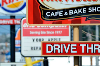 Fast food restaurant signs line Peach Street in Erie, Pa., Aug. 26, 2014.