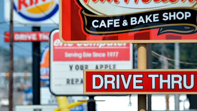 Fast food restaurant signs line Peach Street in Erie, Pa., Aug. 26, 2014.