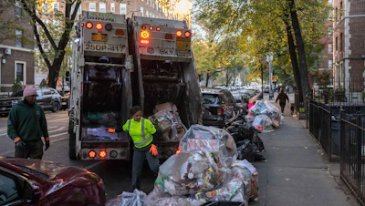 Sanitation workers collect trash in Brooklyn, New York, Nov. 16, 2024.