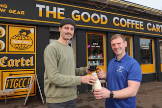 Mossgiel Organic Farm owner Bryce Cunningham, right, with barista Jacob Smith outside The Good Coffee Cartel, Glasgow.