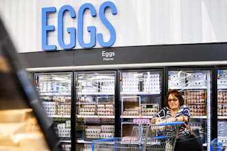 A woman buys eggs at a Walmart Superstore in Secaucus, New Jersey, July 11, 2024.