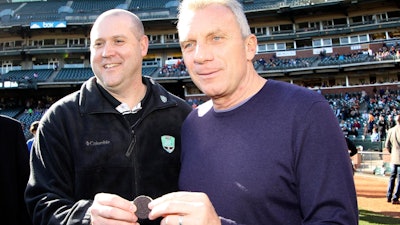 Football great Joe Montana, right, and Mark Clouse, president, Kraft Foods Snacks & Confectionery, in San Francisco, Dec. 31, 2011.
