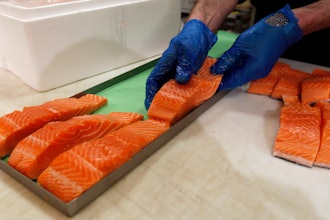 Canadian certified organic farm-raised King Salmon filets are placed on a tray in a store in Fairfax, Va., April 10, 2015.