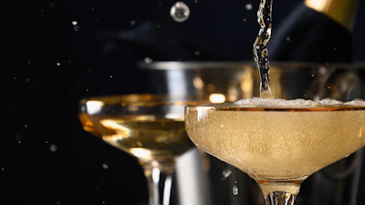Sparkling wine being poured into a glass.