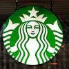 A Starbucks logo sign in the window of one of the chain's cafes in Pittsburgh, Jan. 12, 2017.