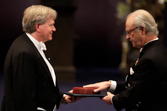 The 2011 Nobel Prize Laureate for Physics Dr Brian P. Schmidt from Australia receives his Nobel Prize from Sweden's King Carl XVI Gustaf, right, during the Nobel Prize award ceremony at the Stockholm Concert Hall in Stockholm, Sweden, Dec. 10, 2011.