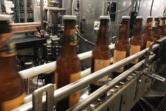 Bottles freshly filled with beer move on a conveyor belt at Lakefront Brewery in Milwaukee, Jan. 14, 2019.