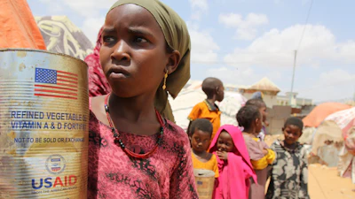 Somali internally displaced persons (IDP) children look out from makeshift homes in Maslah camp on the outskirts of Mogadishu, Somalia, Feb. 5, 2025.
