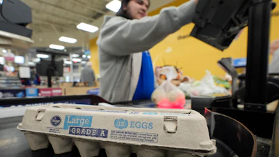 Cashier Josh Jimenez rings up egg for sale at a Dallas grocery store, Feb. 7, 2025.