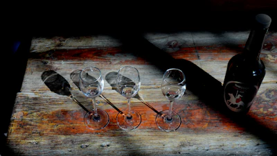 A bottle of Commandaria wine next to three glasses at the Karseras Winery, Doros, Cyprus, Feb. 21, 2025.