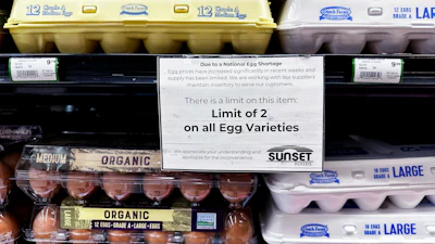 A sign is mounted on a shelve of eggs at a grocery store in Northbrook, Ill., Feb. 28, 2025.