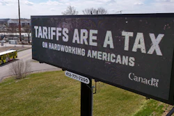 A digital bill board flashes a tariffs message in Kennedy Township, Pa., March 25, 2025.