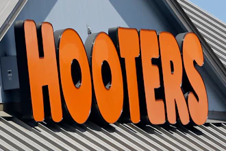 July 27, 2017, shows a Hooters sign at a restaurant in Hialeah, Fla.