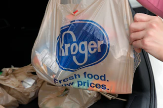 A customer moves purchases at a Kroger grocery store in Flowood, Miss., June 26, 2019.