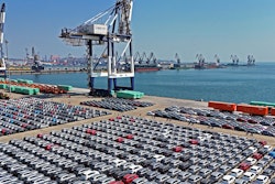 An aerial view of new cars waiting for shipment at a pier for ro-ro ships in Yantai city in eastern China's Shandong province Sunday, March 30, 2025.