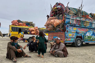 Afghan refugees take rest at a transit station setup to facilitate Afghan refugees' deportations, outskirt of Chaman, a town on the Pakistan and Afghanistan border, Tuesday, April 8, 2025.