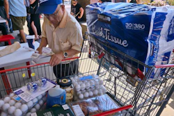 A customer checks his receipts at a Costco Wholesale store in Glendale, Calif., April 10, 2025.