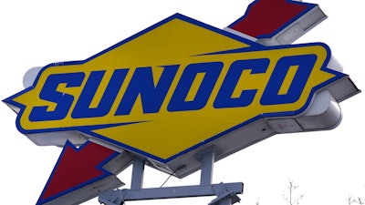 A Sunoco sign is visible outside a gas station, Feb. 27, 2023, in Methuen, Mass.