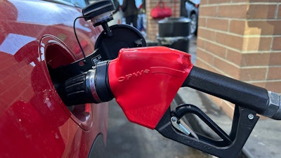 A motorist fills up the tank of a vehicle at a Costco gas station, Feb. 16, 2025, Sheridan, Colo.