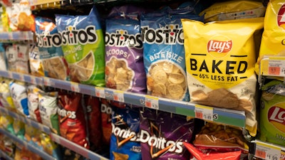 Potato chips are displayed in pharmacy Duane Reade by Walgreens, Thursday, March 25, 2021, in New York. Walgreens reports earnings March 31, 2021.