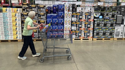 A shopper surveys goods on display in a Costco warehouse Wednesday, May 21, 2025, in Lone Tree, Colo.