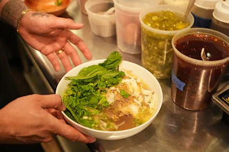 Chef Phila Lorn holds a bowl of the The Mawn Noodle soup at his restaurant, Mawn, in Philadelphia, May 22, 2025.