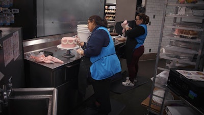 Employees make cakes inside a Walmart Supercenter, North Bergen, N.J., May 28, 2025.