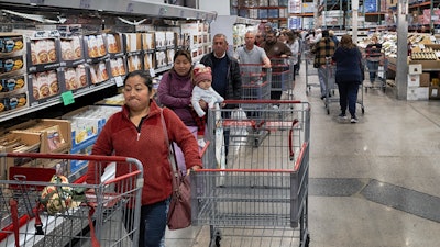 Customers wait in line for eggs at a Costco store in the Van Nuys section of Los Angeles on Wednesday, Feb. 19, 2025.