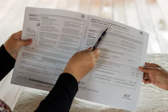 Children's Defense Fund Program Director Graciela Camarena assists Lucia Salazar with filling out Medicaid and SNAP application forms for her family in Pharr, Texas, Nov. 13, 2023.