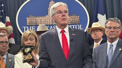 Texas Lt. Gov. Dan Patrick shows products containing THC while calling for a ban on the consumables on Wednesday, May 28, 2025, at the state Capitol in Austin, Texas.